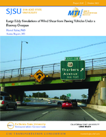 Large Eddy Simulations of Wind Shear From Passing Vehicles Under a Freeway Overpass